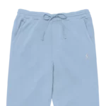 Jogging de sport pour femme en PET recyclé et modal, de couleur bleu clair, avec un élastique resserrant à la taille et aux chevilles. Ce jogging a une coupe décontractée. Photo du produit rapproché pour voir le logo et la taille.