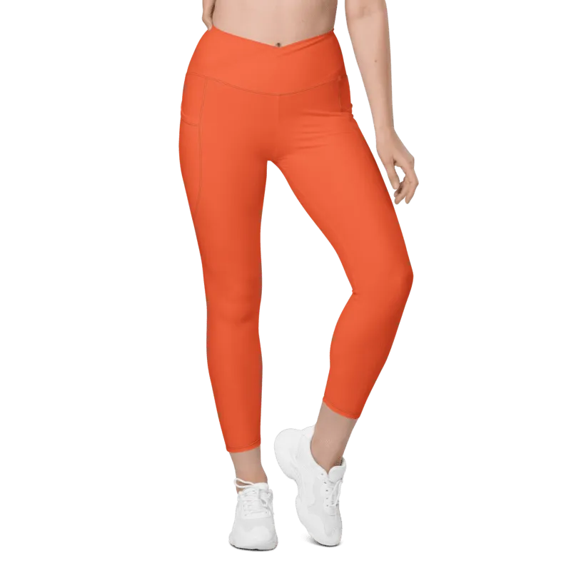 Legging de sport pour femme taille haute avec double poche de couleur orange. Coupe taille haute pour un effet sculptant et un maintien optimal. Photo porté du produit de devant.