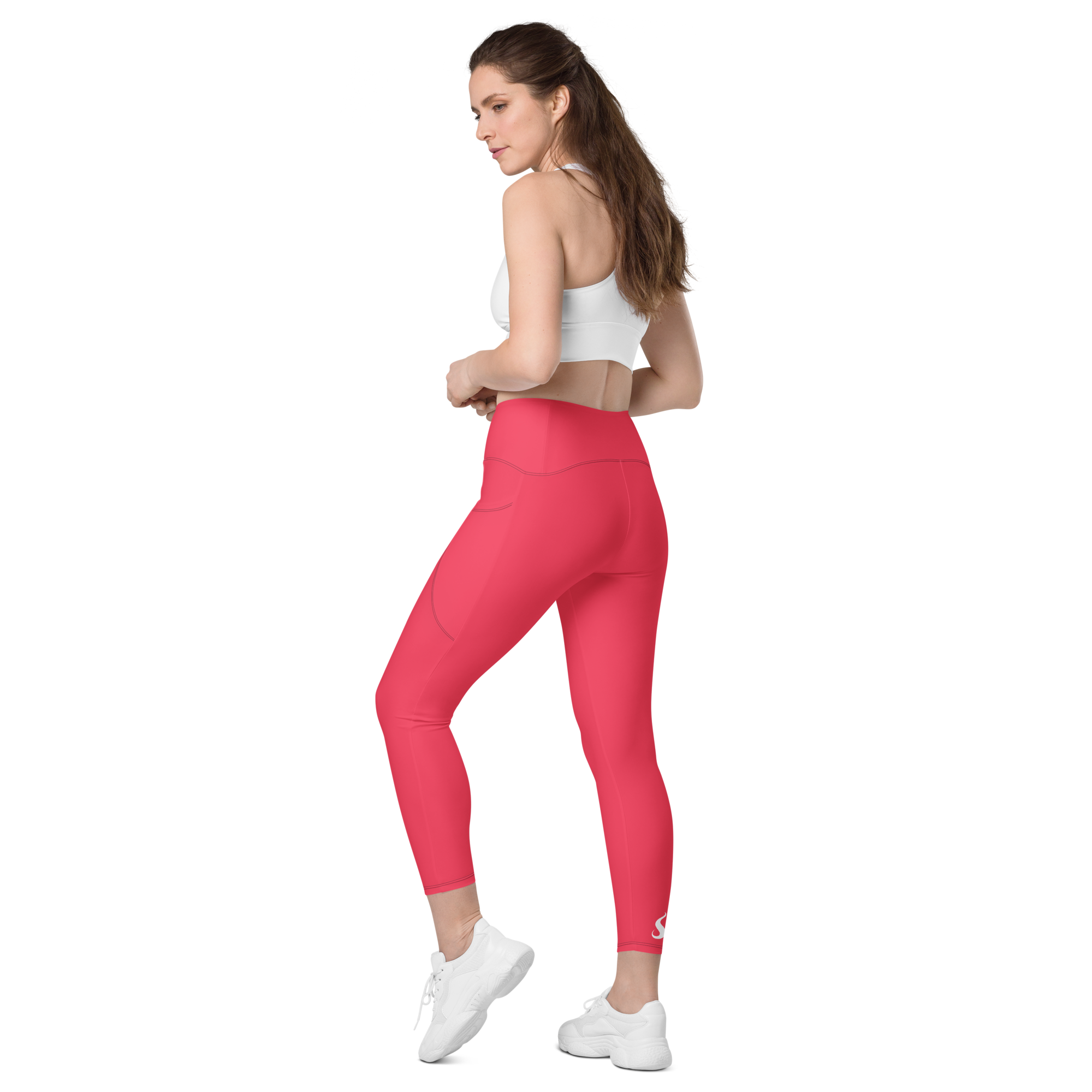 femme portant un legging rose de dos vers la gauche