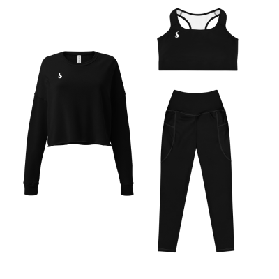 Tenue de sport pour femme composé d'un legging, d'une brassière et d'un pull, tous les vêtements sont noirs.
