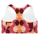Brassière de sport Sweat Hold Up en nylon Econyl, douce et respirante, avec dos nageur pour un maintien léger. Disponible dans plusieurs motifs. Photo du produit de dos avec le motif Rétro avec les couleur orange, rose, bordeaux.