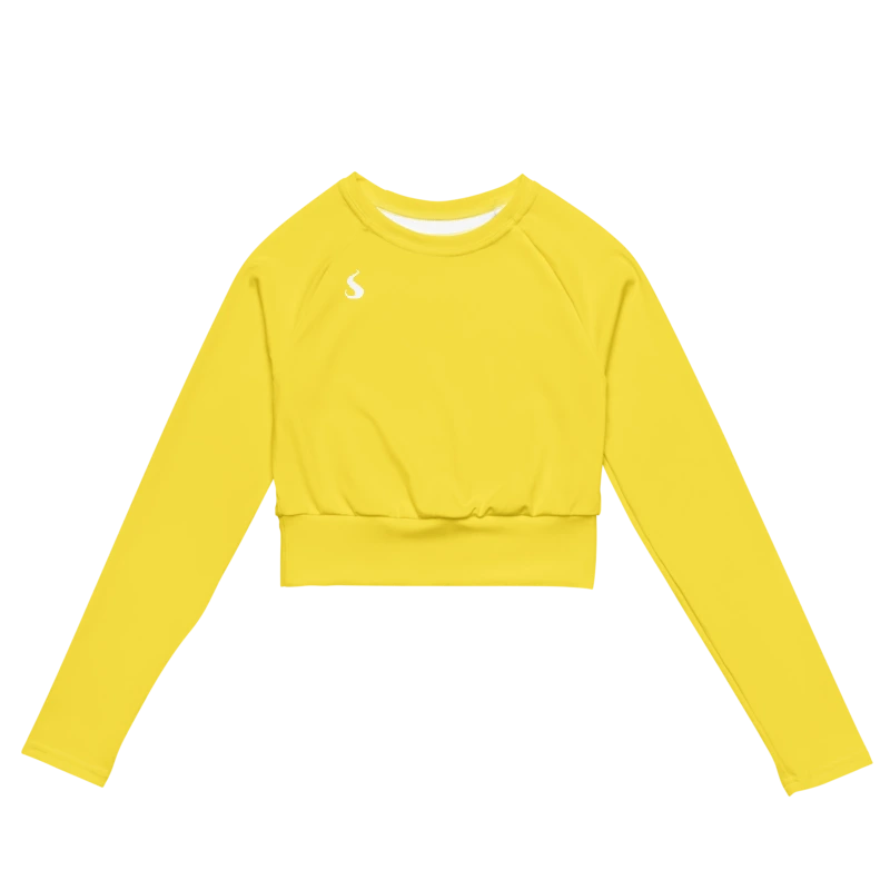 Crop top de sport Hot Focus à manches longues en coloris jaune, conçu pour allier confort et style lors des entraînements. photo de face du produit.