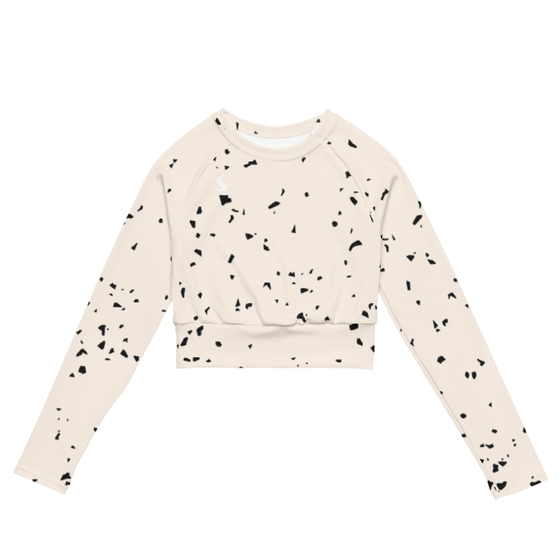 Crop top de sport Hot Focus à manches longues, blanc cassé à pois noirs, conçu pour allier confort et style lors des entraînements. photo de face du produit.
