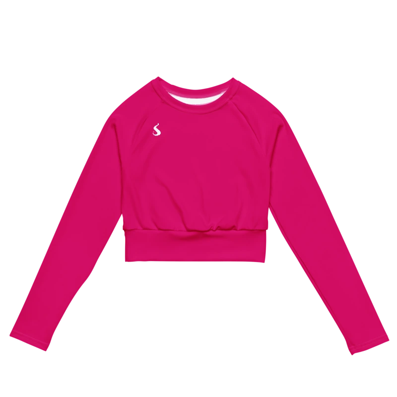 Crop top de sport Hot Focus à manches longues en coloris rose, conçu pour allier confort et style lors des entraînements. photo de face du produit.